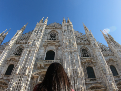 traveler woman Poses Against Background Of Duomo In Milan